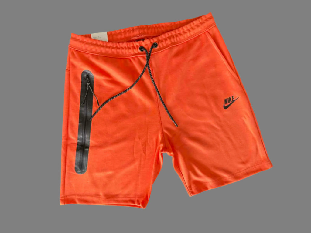 Nike Tech Fleece sportnadrág férfiaknak, narancssárga színben.